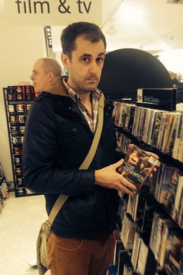 Nathan Head with The Lost Generation DVDs on the shelves of HMV in the Arndale Centre in Manchester